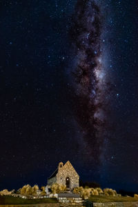 Old building against sky at night