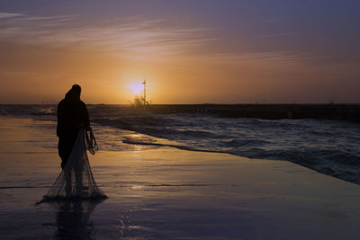 Scenic view of sea at sunset