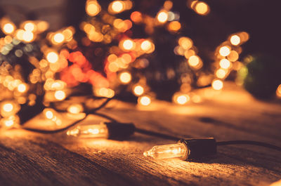 Close-up of illuminated christmas lights on table