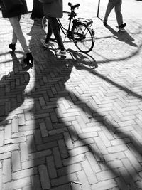 Low section of people walking on street