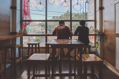 Rear view of people sitting in restaurant