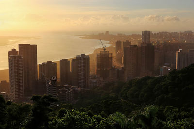 View of cityscape against sky during sunset