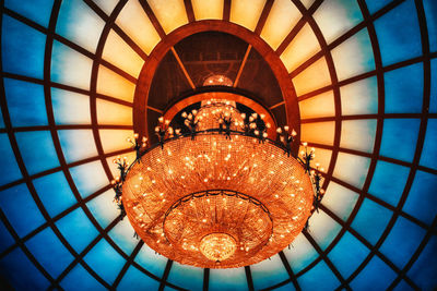 Low angle view of illuminated chandelier