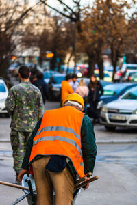 Rear view of man walking on street