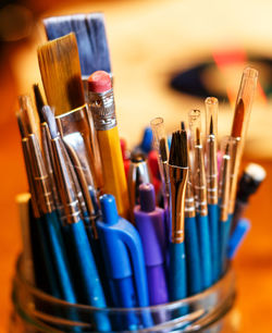 Close-up of paintbrushes on table