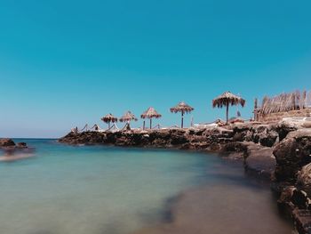 Scenic view of sea against clear blue sky