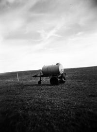 Tractor on field against sky