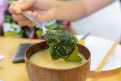 Cropped hand of man preparing food