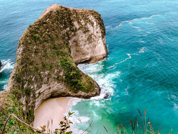 High angle view of rock formation in sea