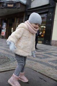 Rear view of woman walking on street