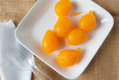 High angle view of fruits in plate on table