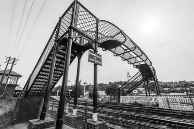 Low angle view of railroad tracks against sky