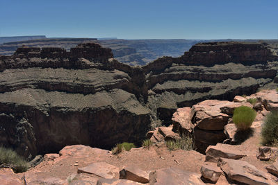 Rock formations on landscape against sky