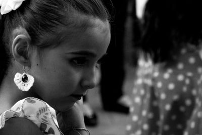 Side view of girl wearing earring outdoors