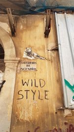 Low angle view of text on building