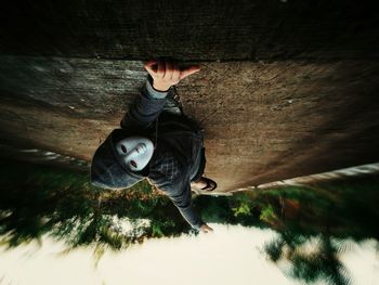 Portrait of young woman jumping