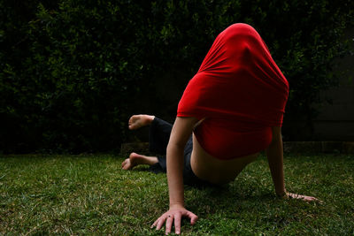 Rear view of woman on field