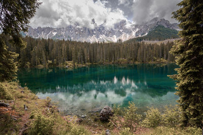 Scenic view of lake and mountains against sky