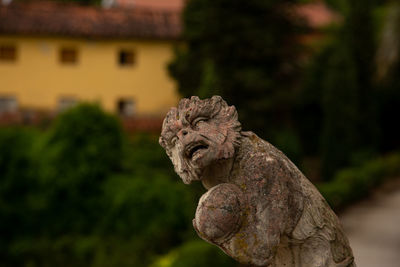 Close-up of statue against building