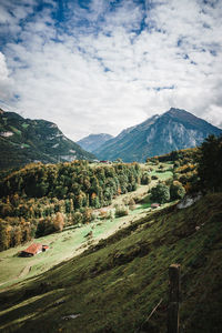 Scenic view of landscape and mountains against sky