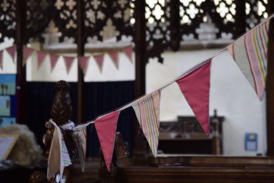 View of flags hanging in row