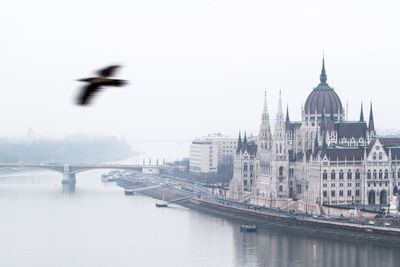 View of river with buildings in background