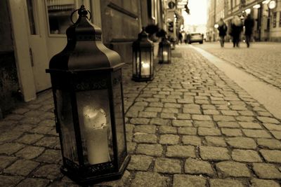 View of illuminated empty road