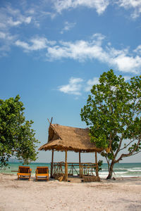 Built structure on beach against sky