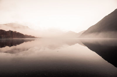 Scenic view of lake with mountains in background