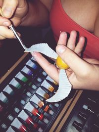Midsection of woman holding ice cream