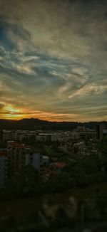 High angle view of buildings against sky during sunset