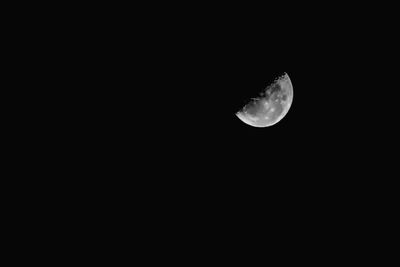 Low angle view of moon against clear sky at night