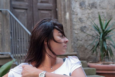 Portrait of a young woman looking away