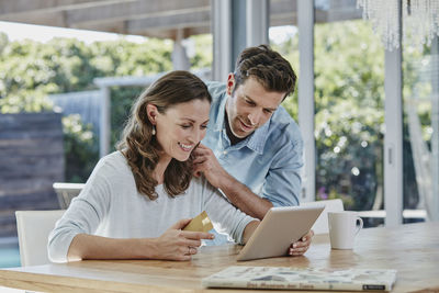 Senior couple doing online payment with credit card