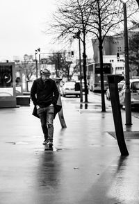 Man walking on street in city