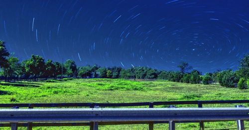 Scenic view of field against sky at night