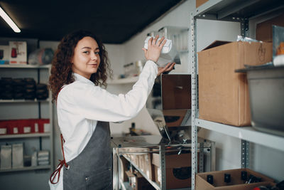 Portrait of young woman in store