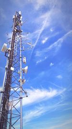 Low angle view of communications tower against sky