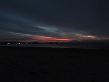 Scenic view of sea against sky at night