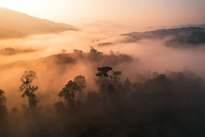 Scenic view of mountains against sky during sunset