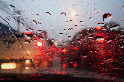 Water drops on the windshield. in the atmosphere of the road in the rain.