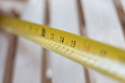 Close-up of measuring tape on table