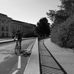 Man riding bicycle on street