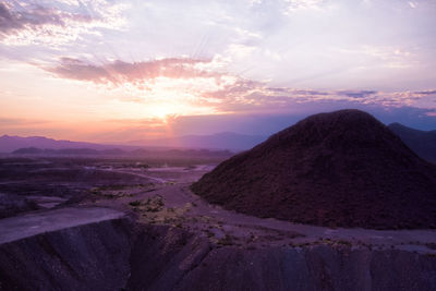 Scenic view of landscape against sky during sunset