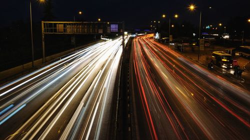 High angle view of light trails on road at night