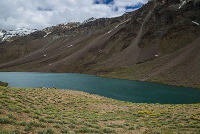 Scenic view of lake and mountains against sky