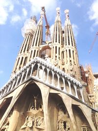 Low angle view of cathedral against cloudy sky