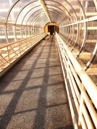 Footpath in illuminated tunnel