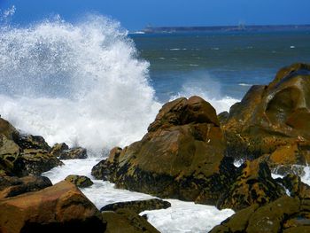 Sea waves splashing on rocks