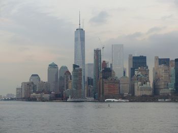 Skyscrapers in city against sky